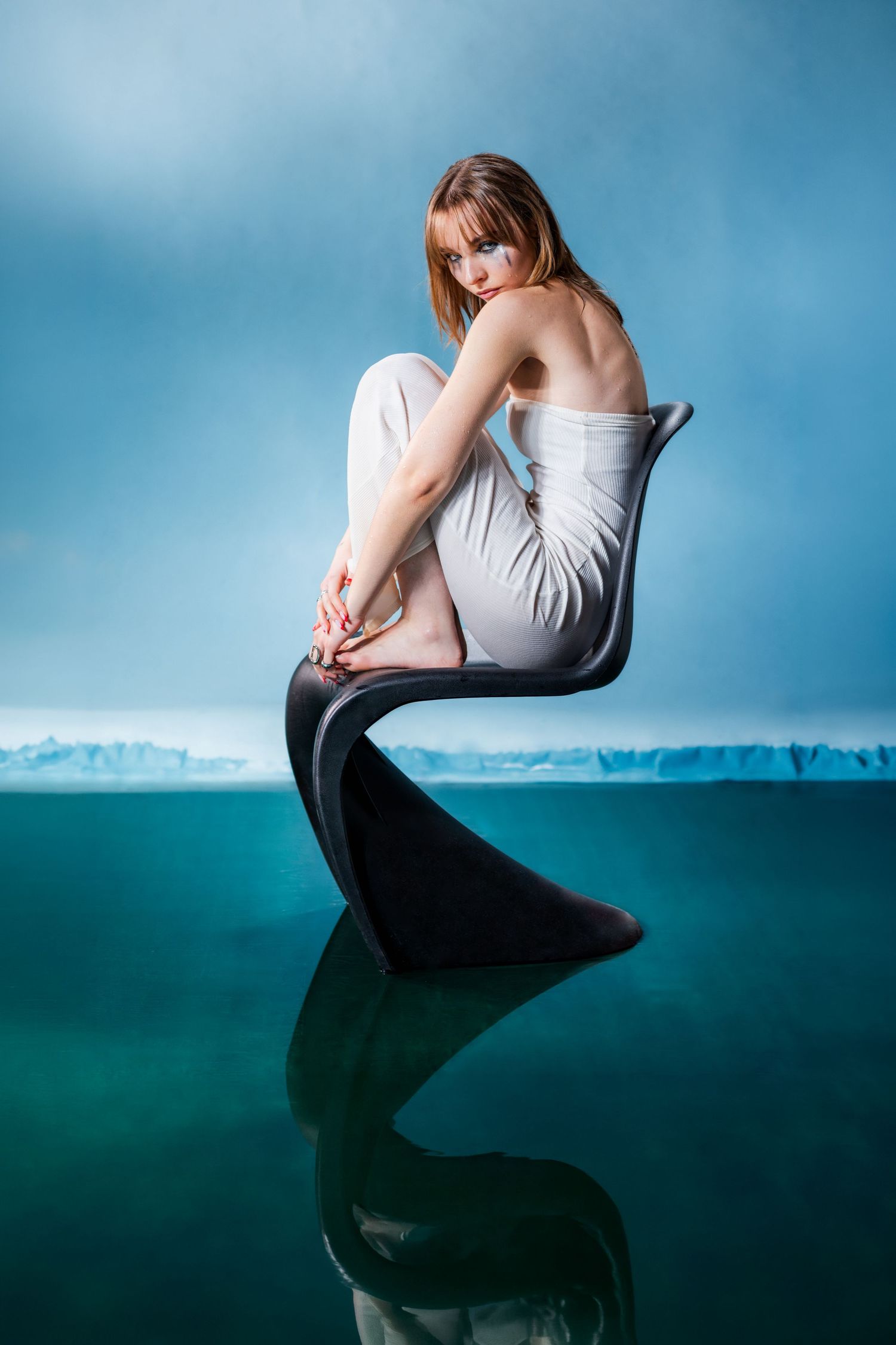 Editorial beauty portrait photography with cinematic blue background