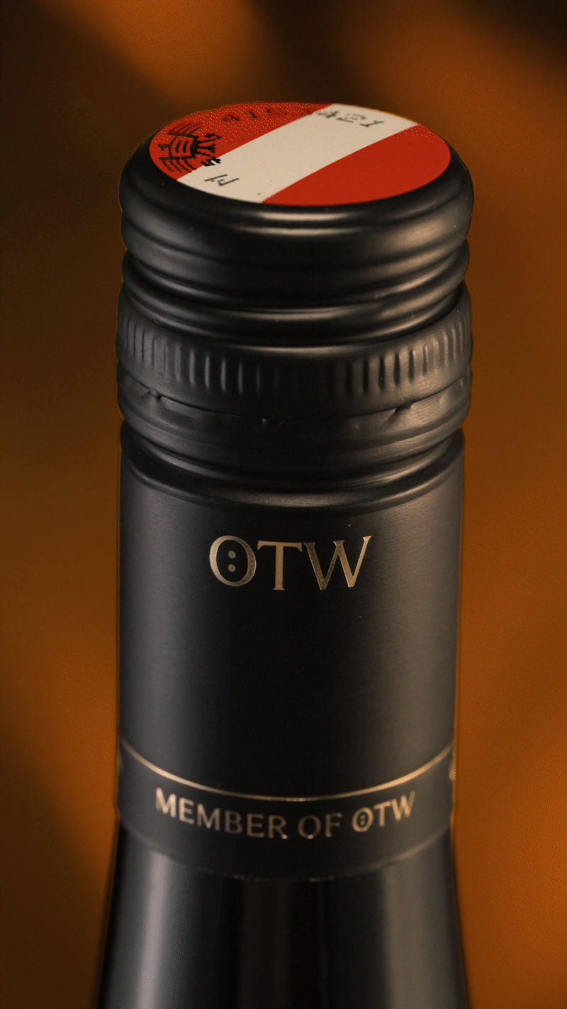 Close-up cinematic shot of a premium wine bottle cap highlighting craftsmanship and luxury branding.