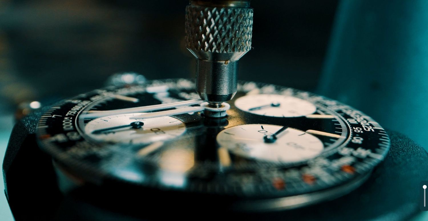 Cinematic luxury watch photography with atmospheric blue lighting