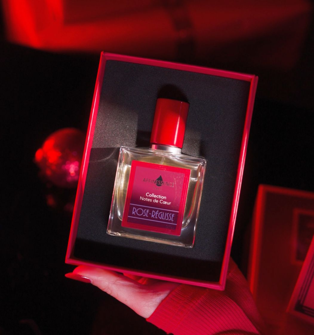 Luxury fragrance product photography with dramatic red cinematic lighting for Olfattorio