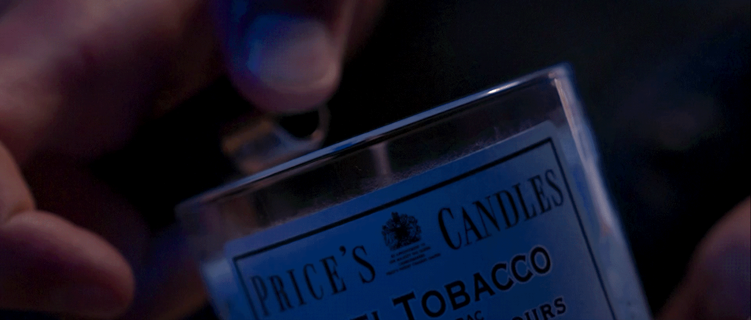 Luxury scented candle product shot with cinematic macro cinematography and atmospheric lighting.