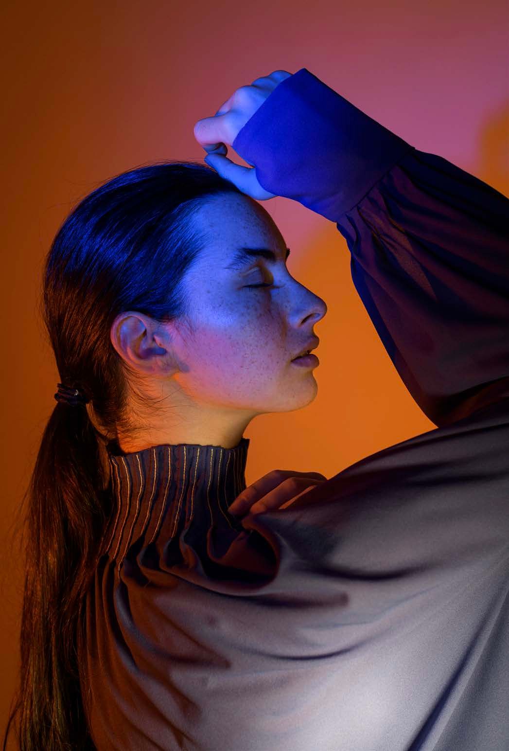 Creative cinematic portrait photography with blue and orange lighting