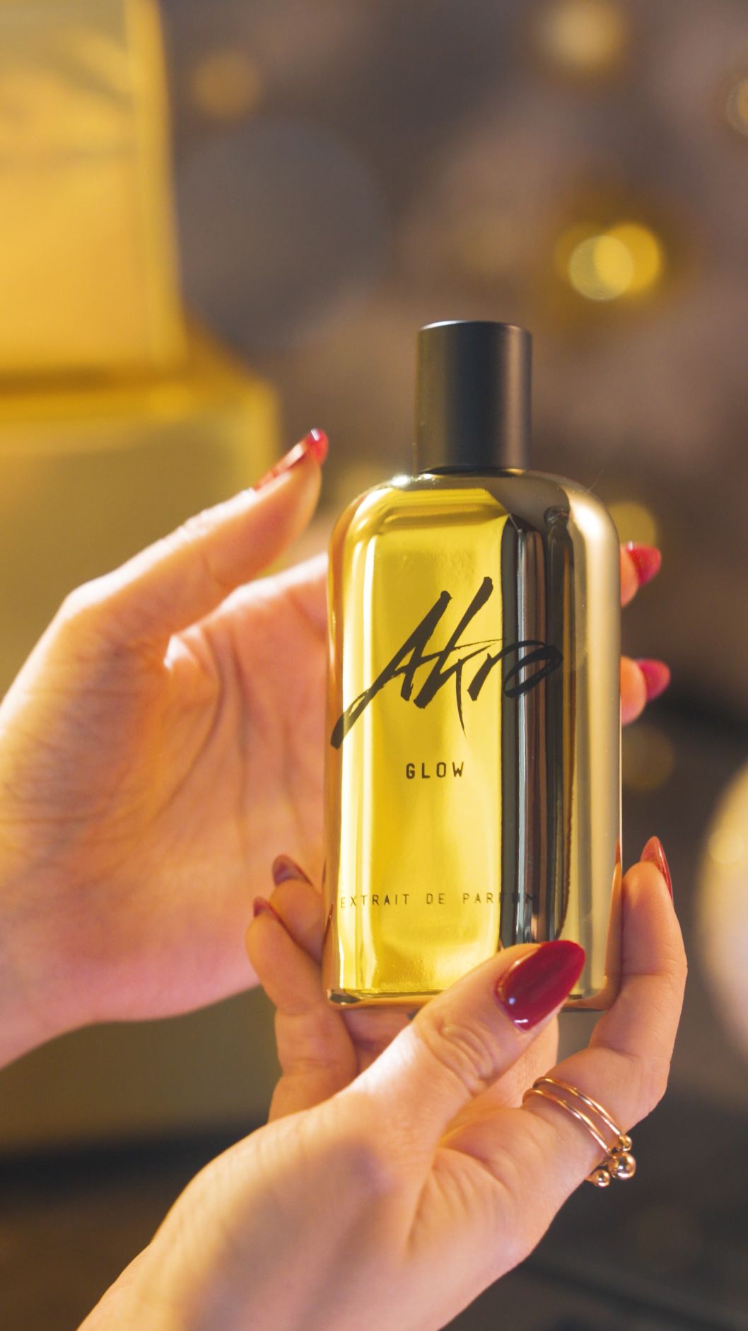 Cinematic perfume photography with luxury golden reflections for Akro and Olfattorio