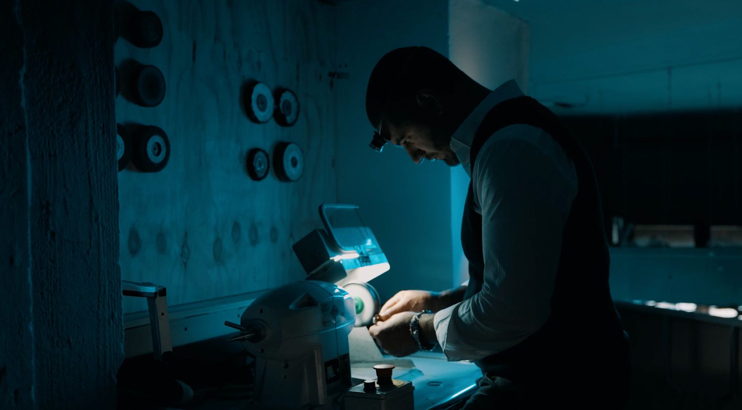Watchmaker craftsmanship photography with cinematic industrial atmosphere
