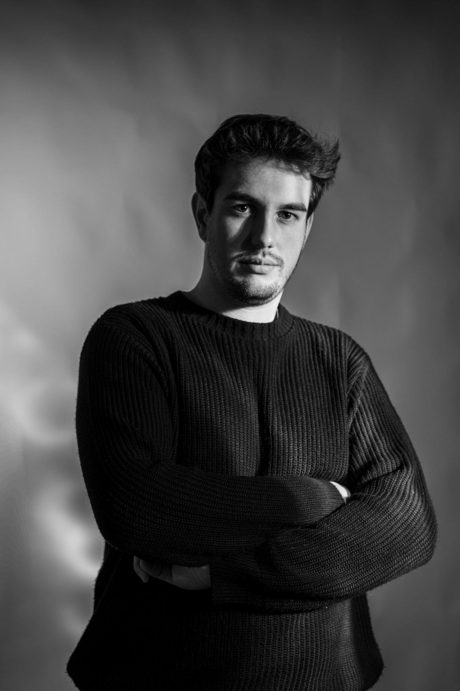 Black and white cinematic portrait of filmmaker Luca Gastaldi