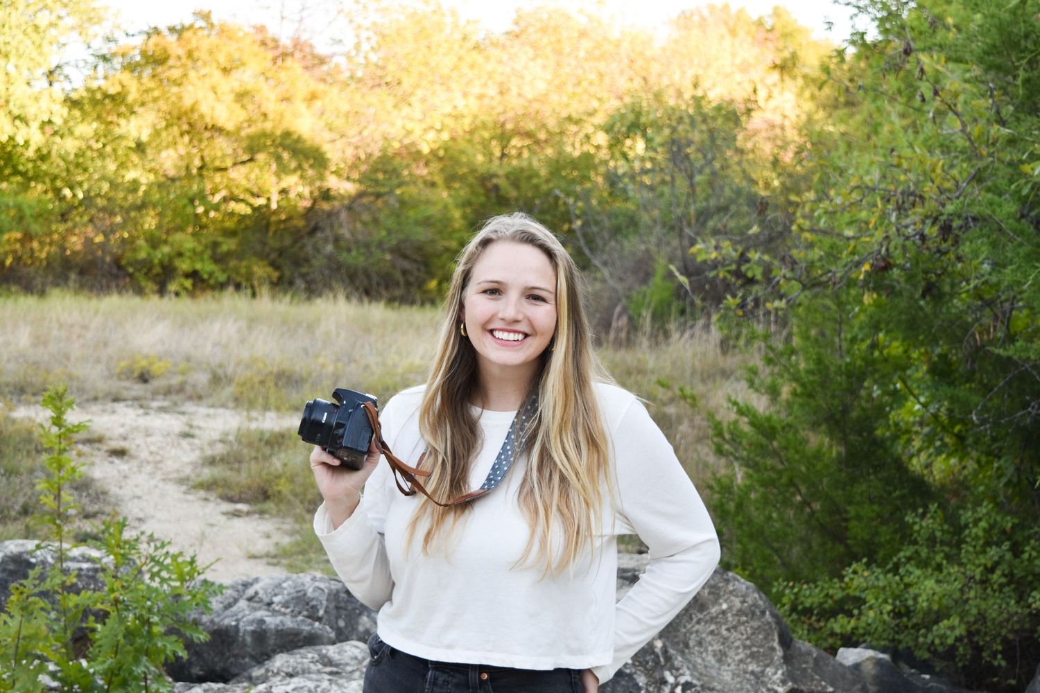 Alaina Joy, owner and lead photographer at Alaina Joy Photograph, specializing in vibrant family, newborn, and senior photography in Plano.