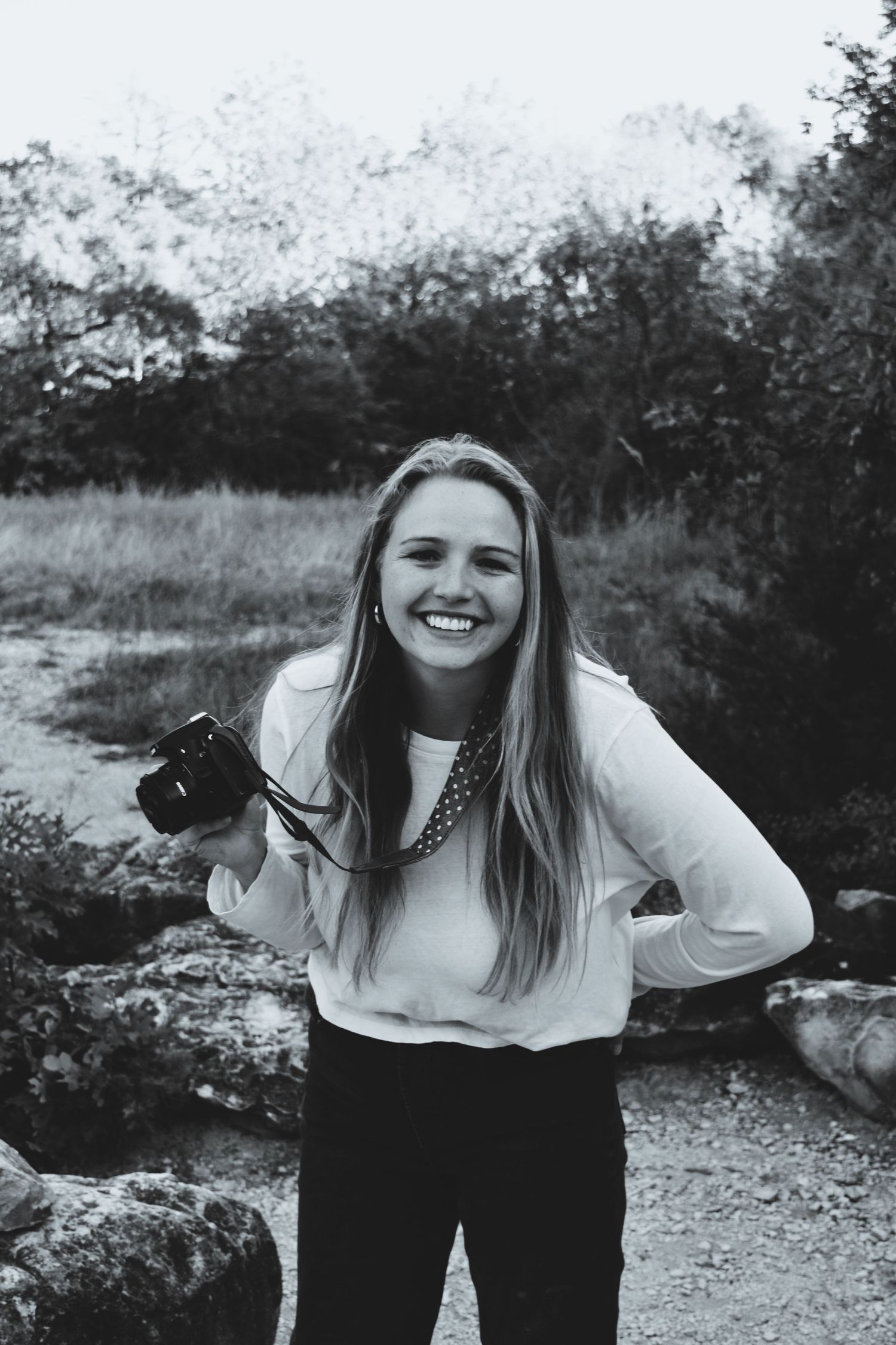 Alaina Joy, owner and lead photographer at Alaina Joy Photograph, specializing in vibrant family, newborn, and senior photography in Plano.