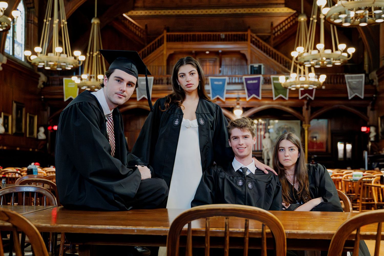 Graduation portrait of friends in Harvard's dining hall