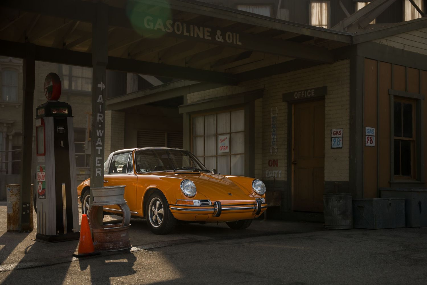 Yellow Porsche getting gas