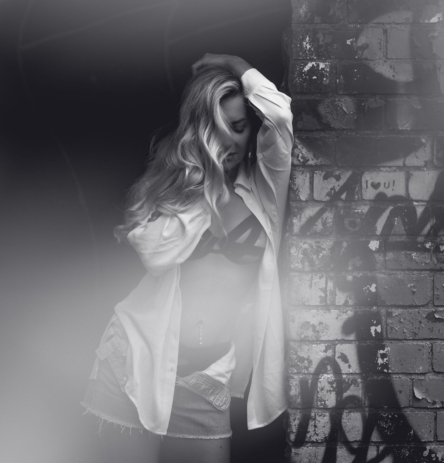 Multiple exposure black and white artistic portrait showing ethereal movement.