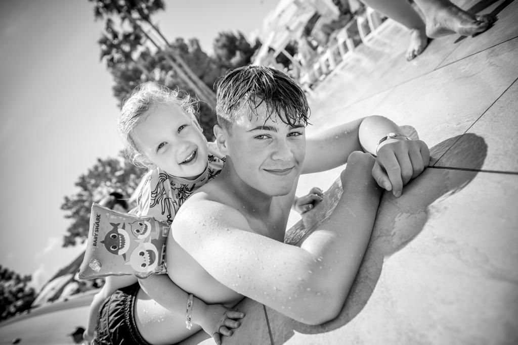 Black and white candid moments of family play and interaction.