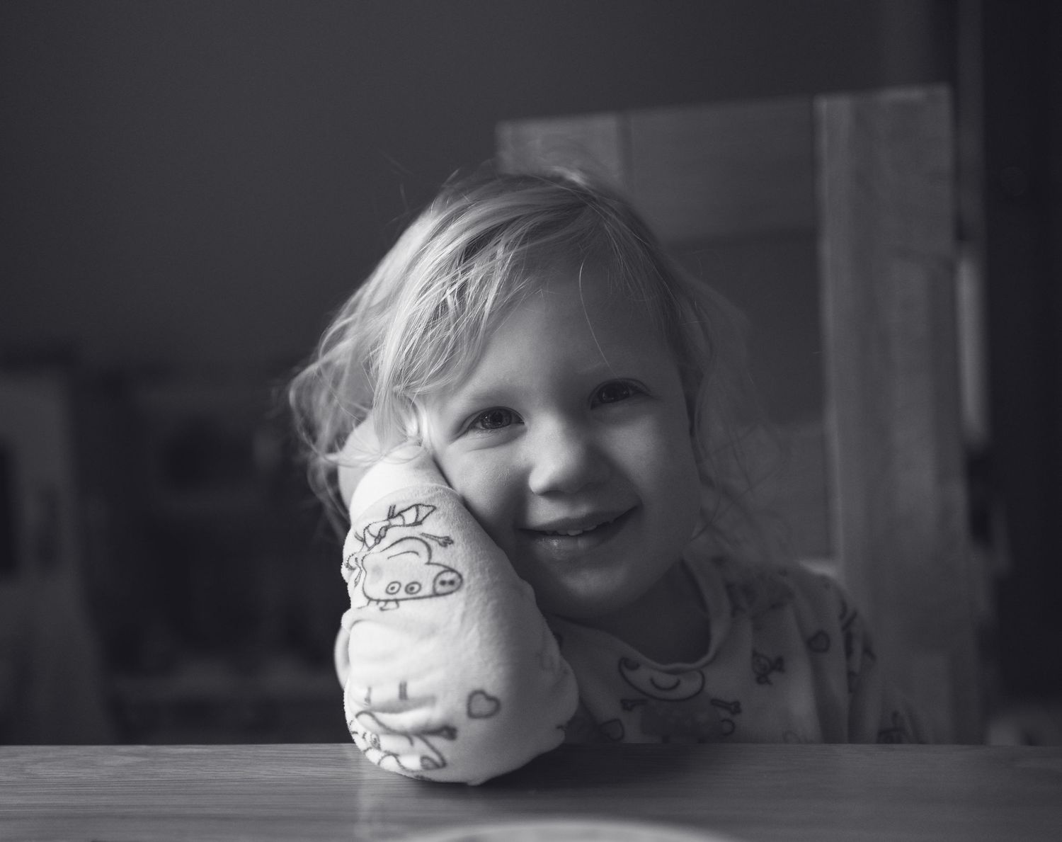 Artistic black and white portraits with whimsical face paint designs.