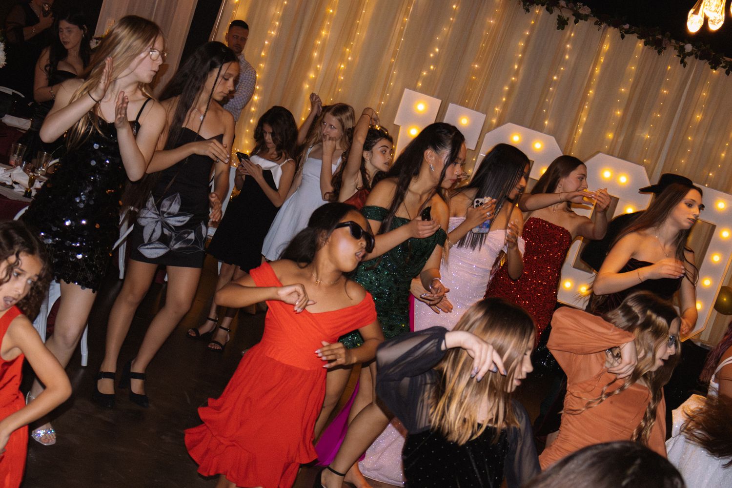 Image of Victoria's School of Dance dancers celebrating at their National Dance Honors Society induction ceremony