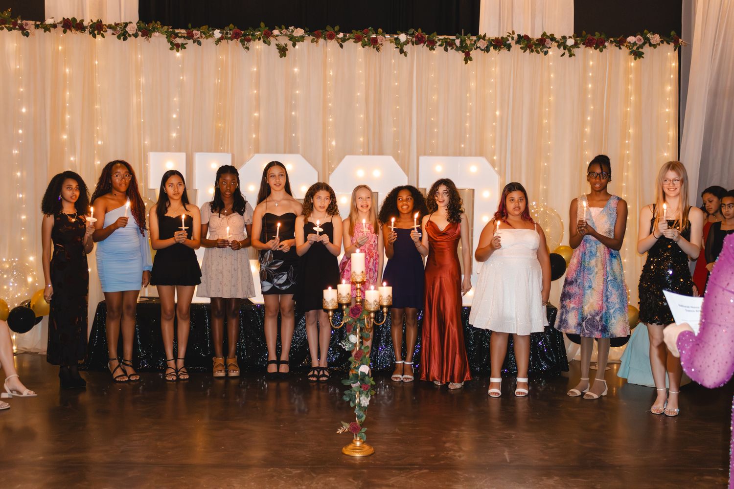 Image of Victoria's School of Dance dancers celebrating at their National Dance Honors Society induction ceremony