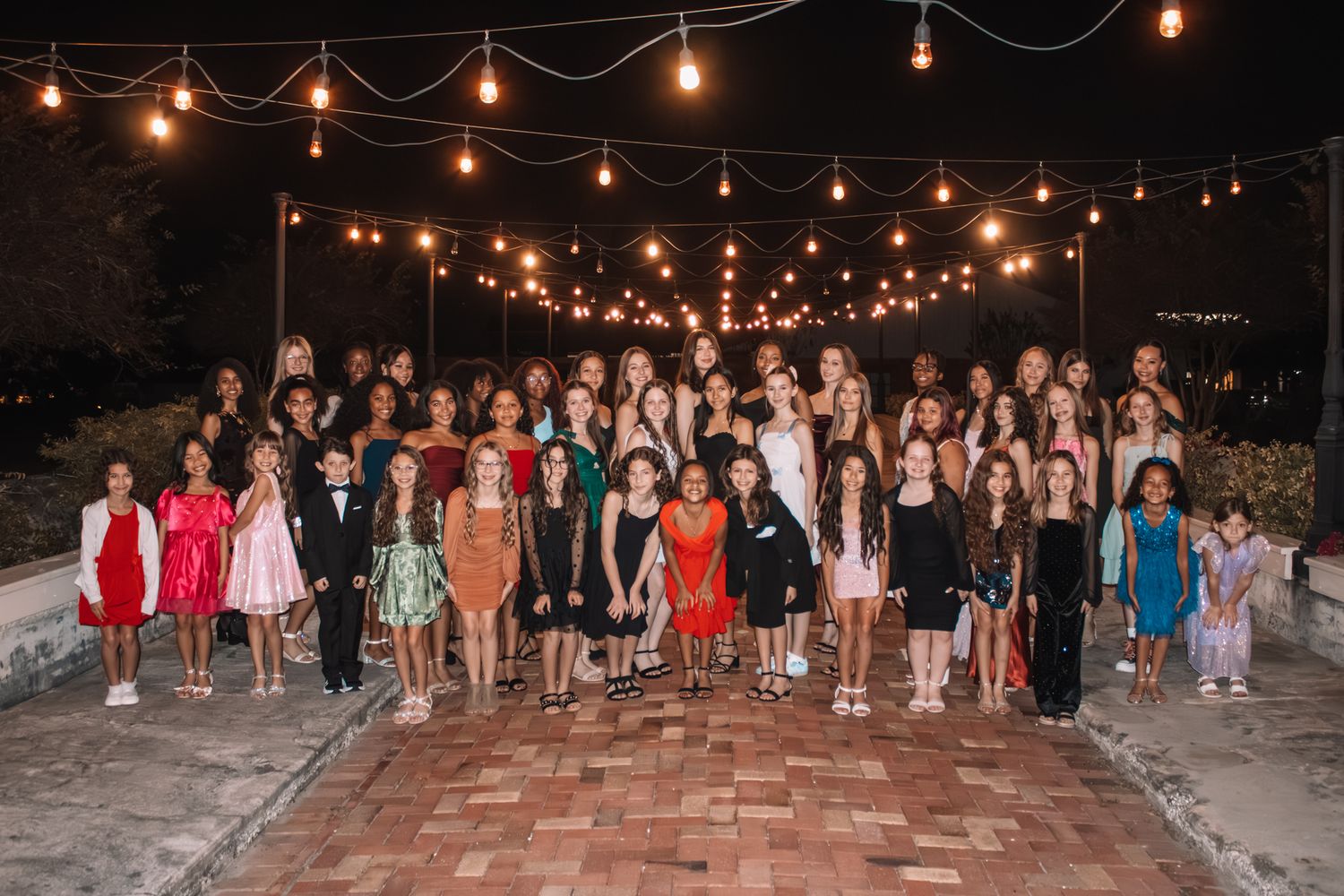 Image of Victoria's School of Dance dancers celebrating at their National Dance Honors Society induction ceremony