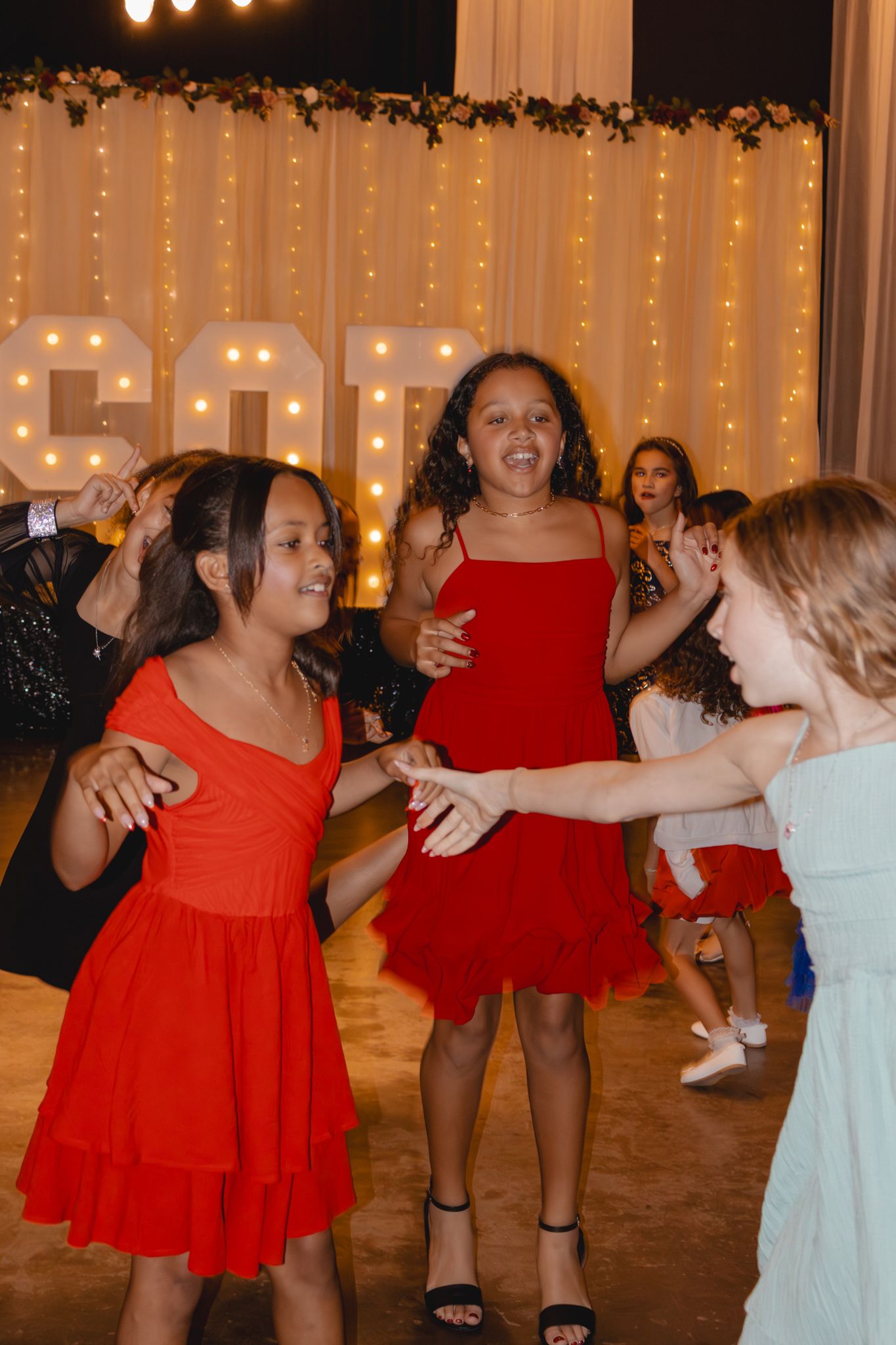 Image of Victoria's School of Dance dancers celebrating at their National Dance Honors Society induction ceremony