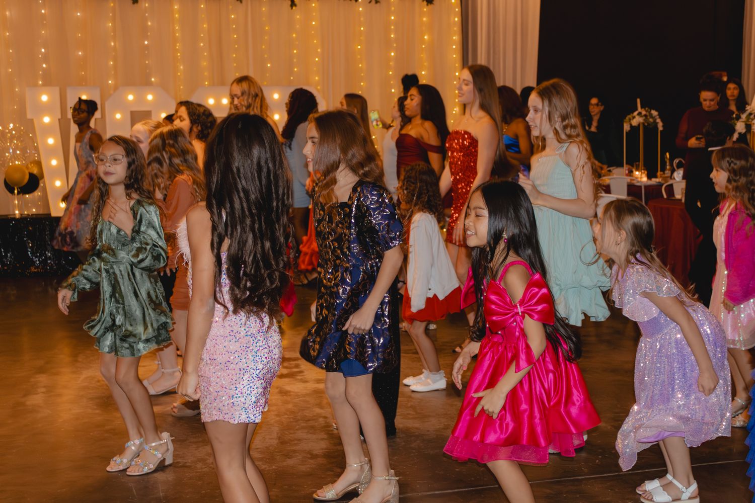 Image of Victoria's School of Dance dancers celebrating at their National Dance Honors Society induction ceremony