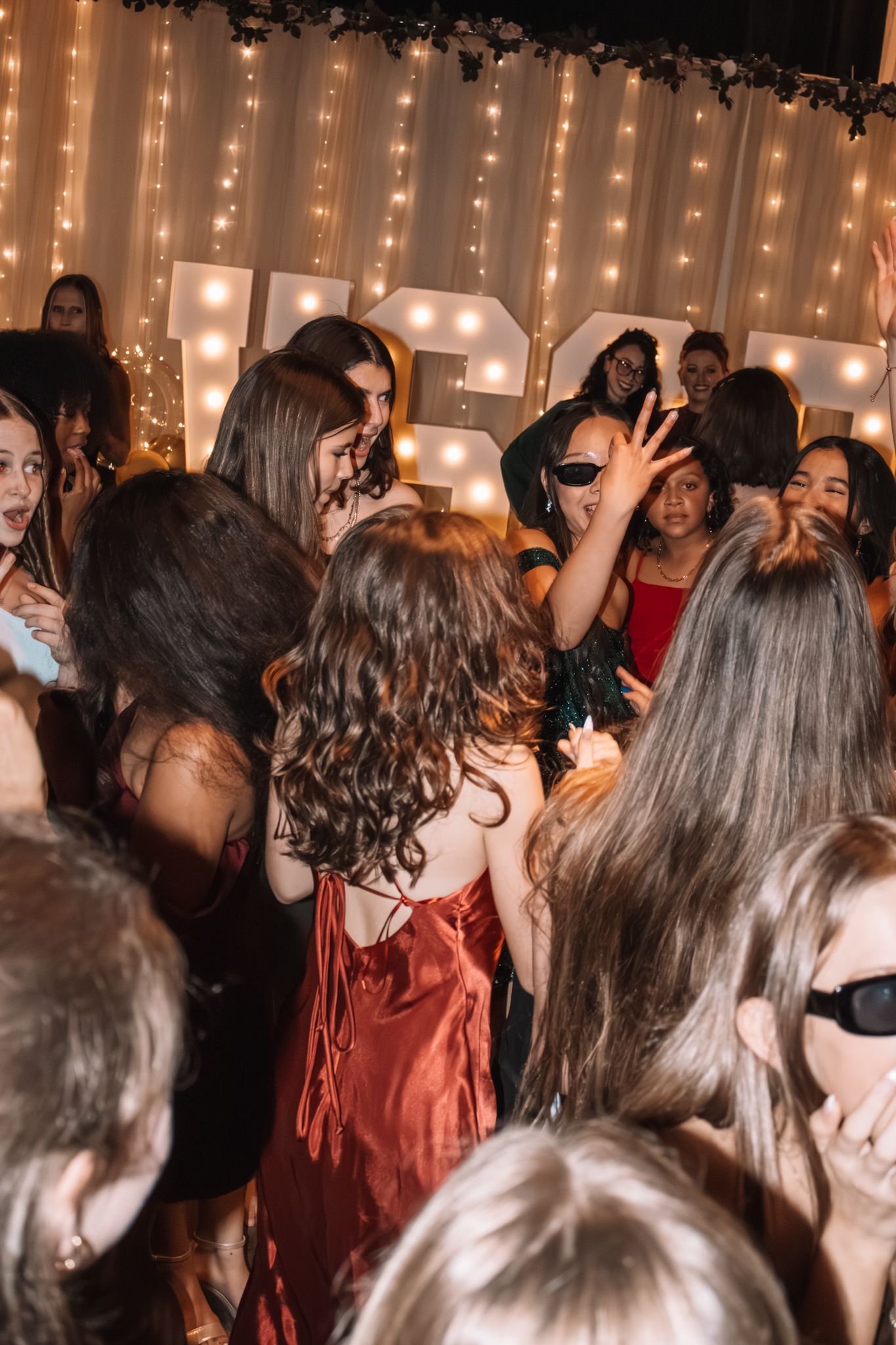 Image of Victoria's School of Dance dancers celebrating at their National Dance Honors Society induction ceremony