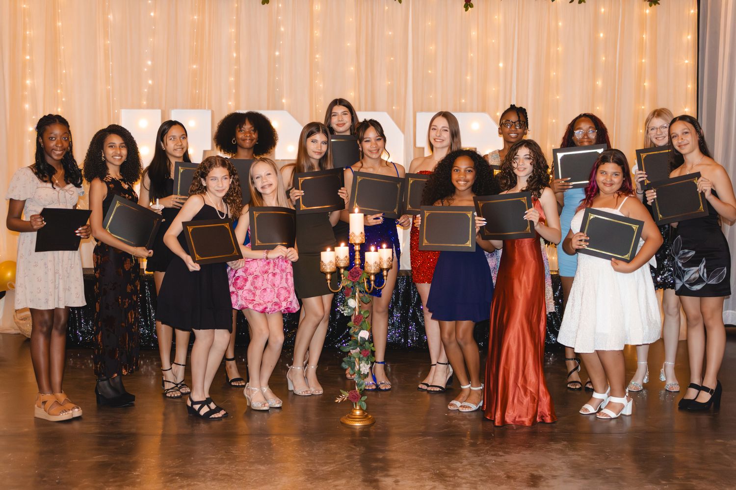 Image of Victoria's School of Dance dancers celebrating at their National Dance Honors Society induction ceremony