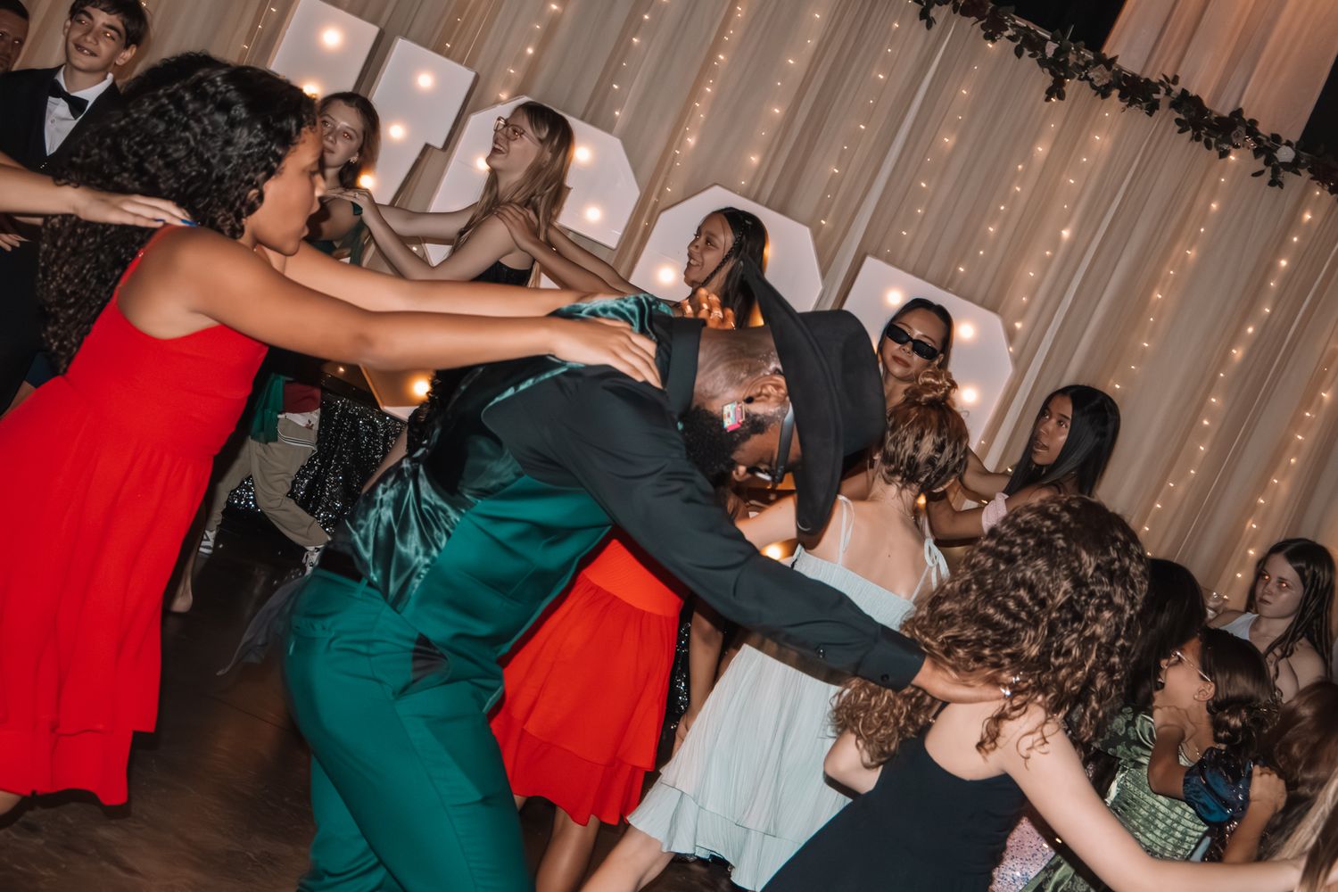 Image of Victoria's School of Dance dancers celebrating at their National Dance Honors Society induction ceremony