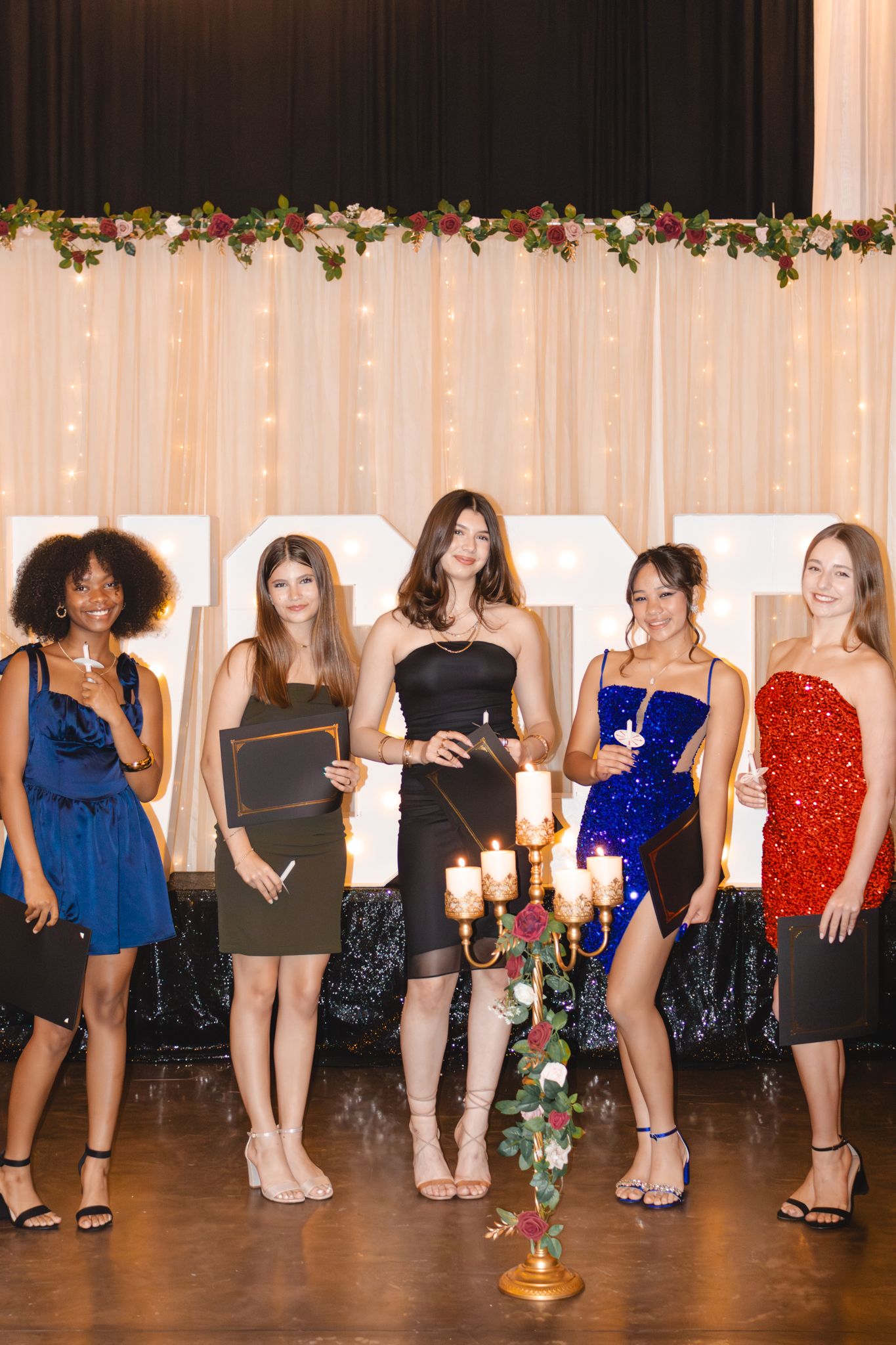 Image of Victoria's School of Dance dancers celebrating at their National Dance Honors Society induction ceremony