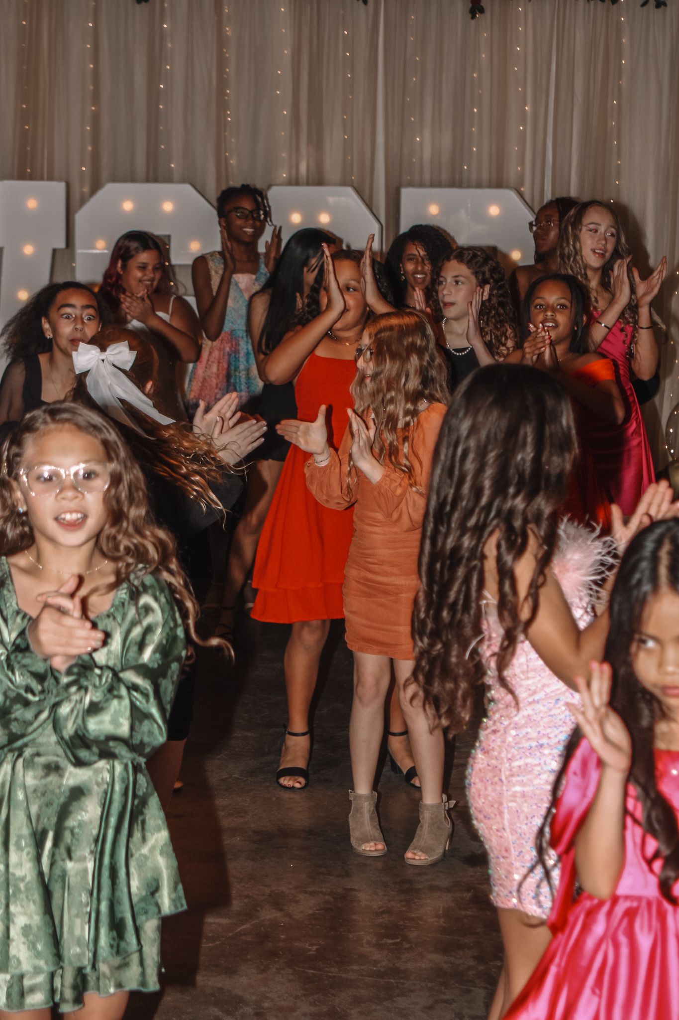 Image of Victoria's School of Dance dancers celebrating at their National Dance Honors Society induction ceremony