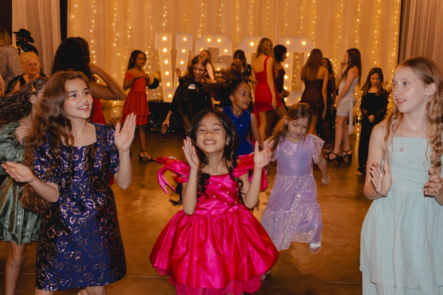 Image of Victoria's School of Dance dancers celebrating at their National Dance Honors Society induction ceremony