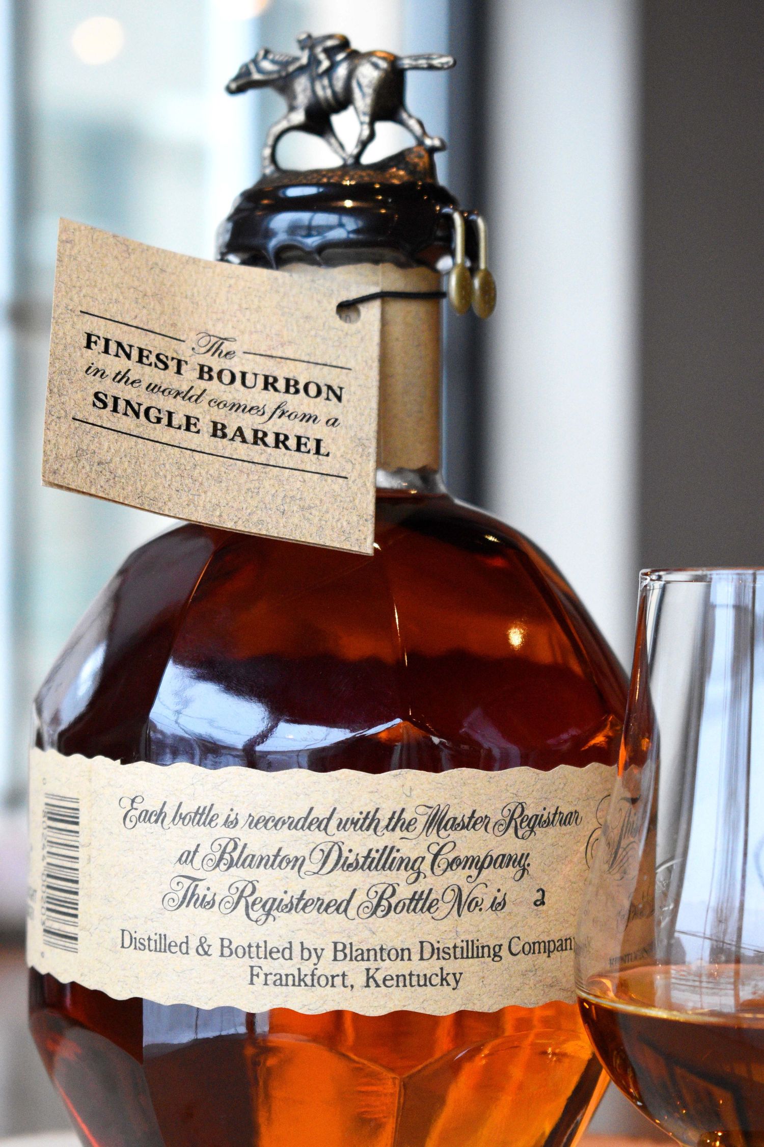Blanton's Single Barrel Bourbon Whiskey bottle showing registered bottle tag, distilled in Frankfort, Kentucky.