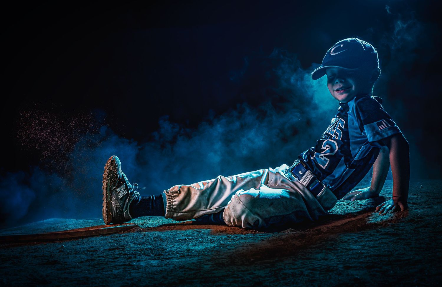 Dramatic low angle baseball action shots with blue lighting effects.