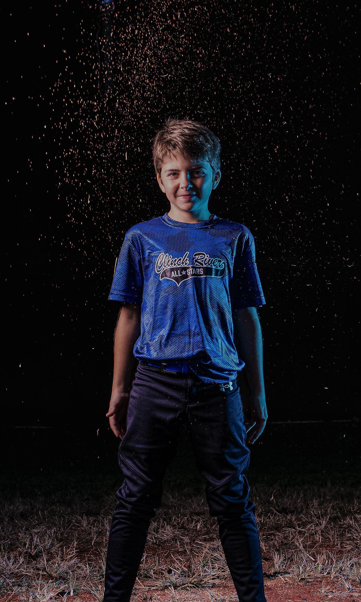 Dramatic nighttime photo sequence showing someone in a blue t-shirt and dark pants against a starry black background.