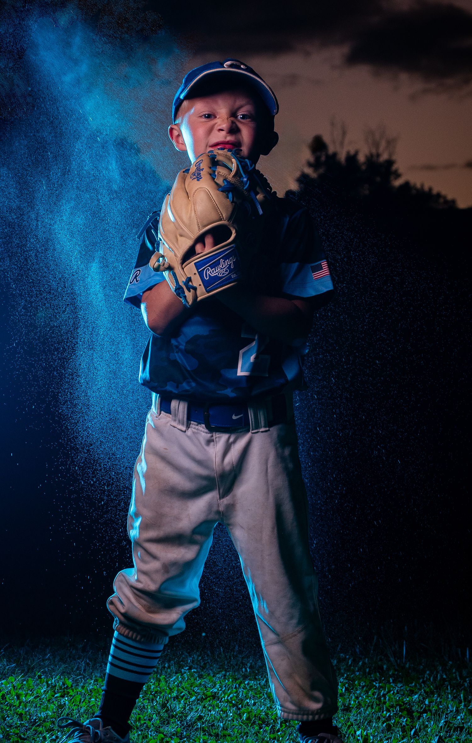 Baseball player demonstrates various action poses in blue lighting.