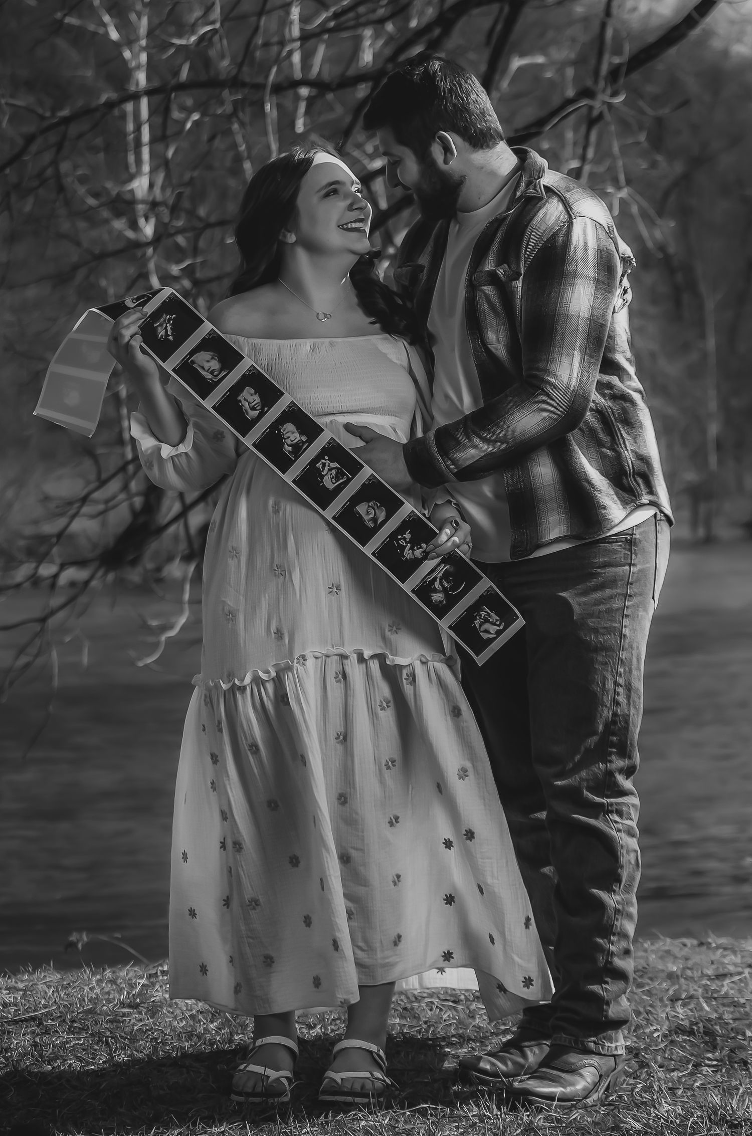 Black and white photo series showing a couple in casual attire embracing outdoors in a natural setting.