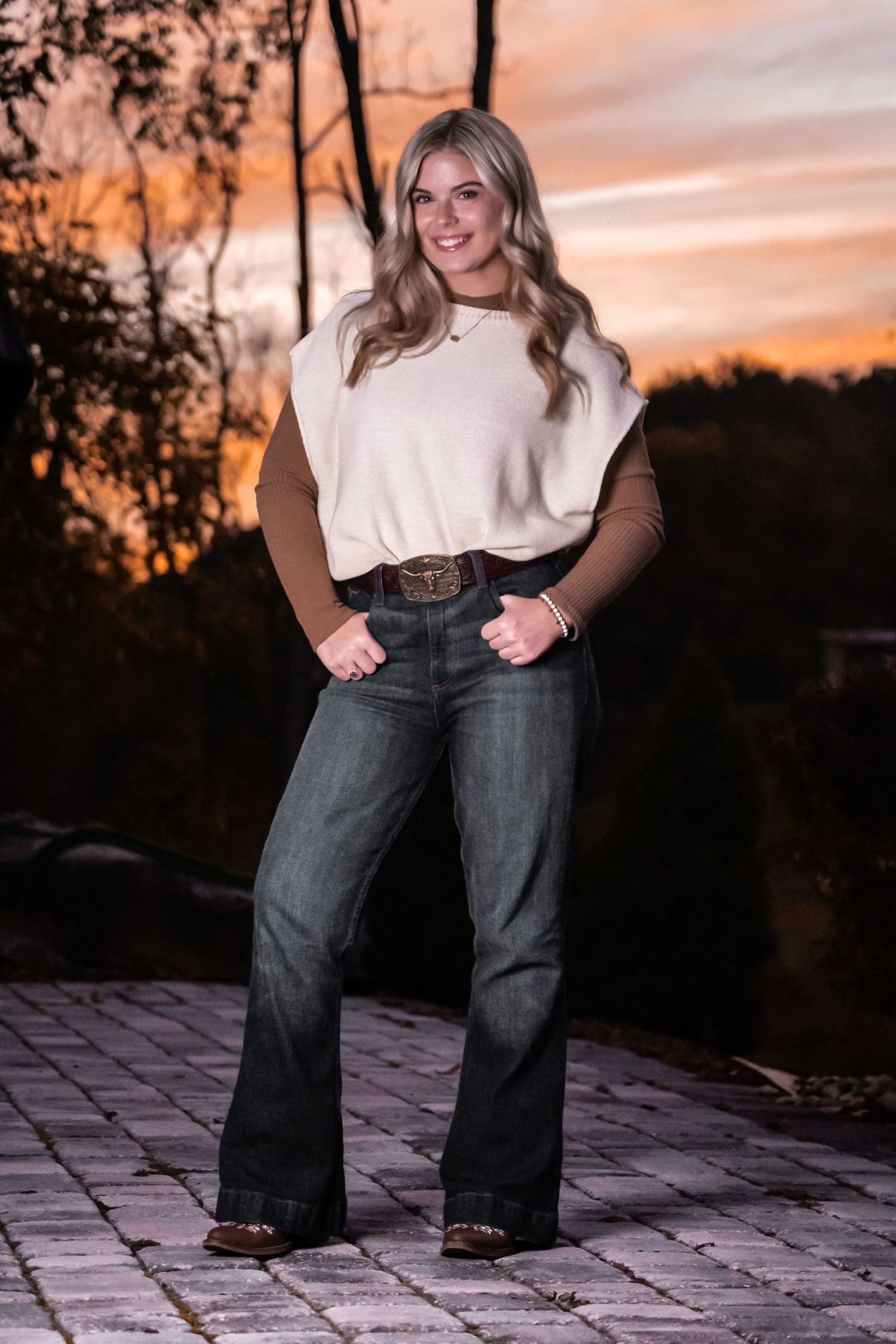 Sunset portrait session showing wide-leg jeans and casual style.