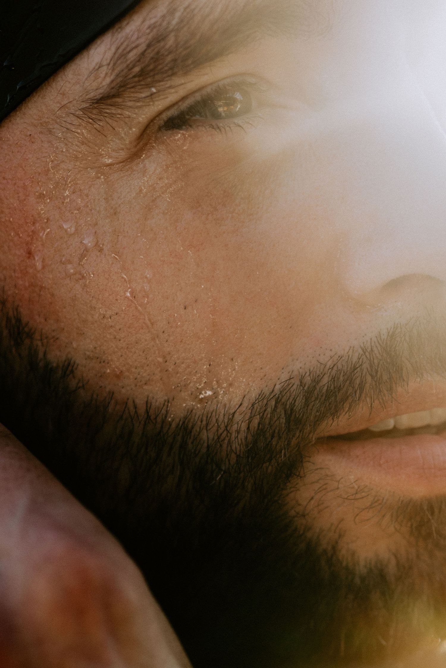 Extreme close-up macro shot showing facial hair and skin texture.
