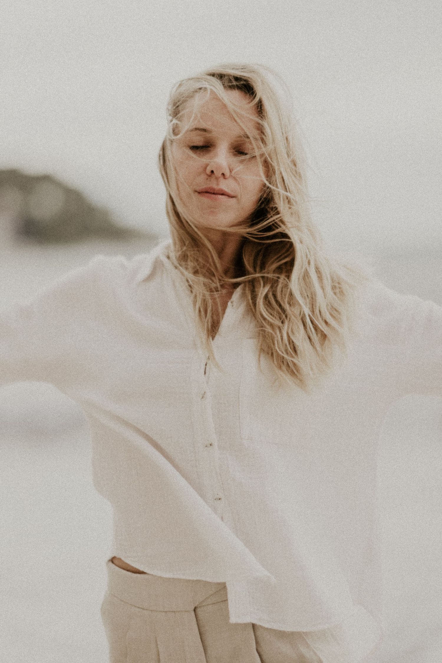 Dreamy fashion portraits in white clothing against light neutral background.