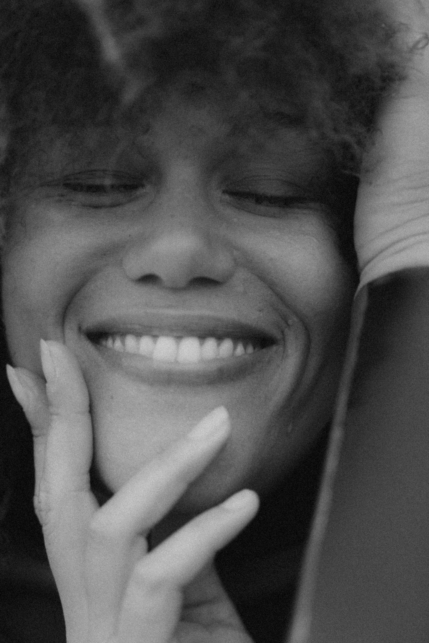 Black and white sequence showing joyful expressions and natural laughter.