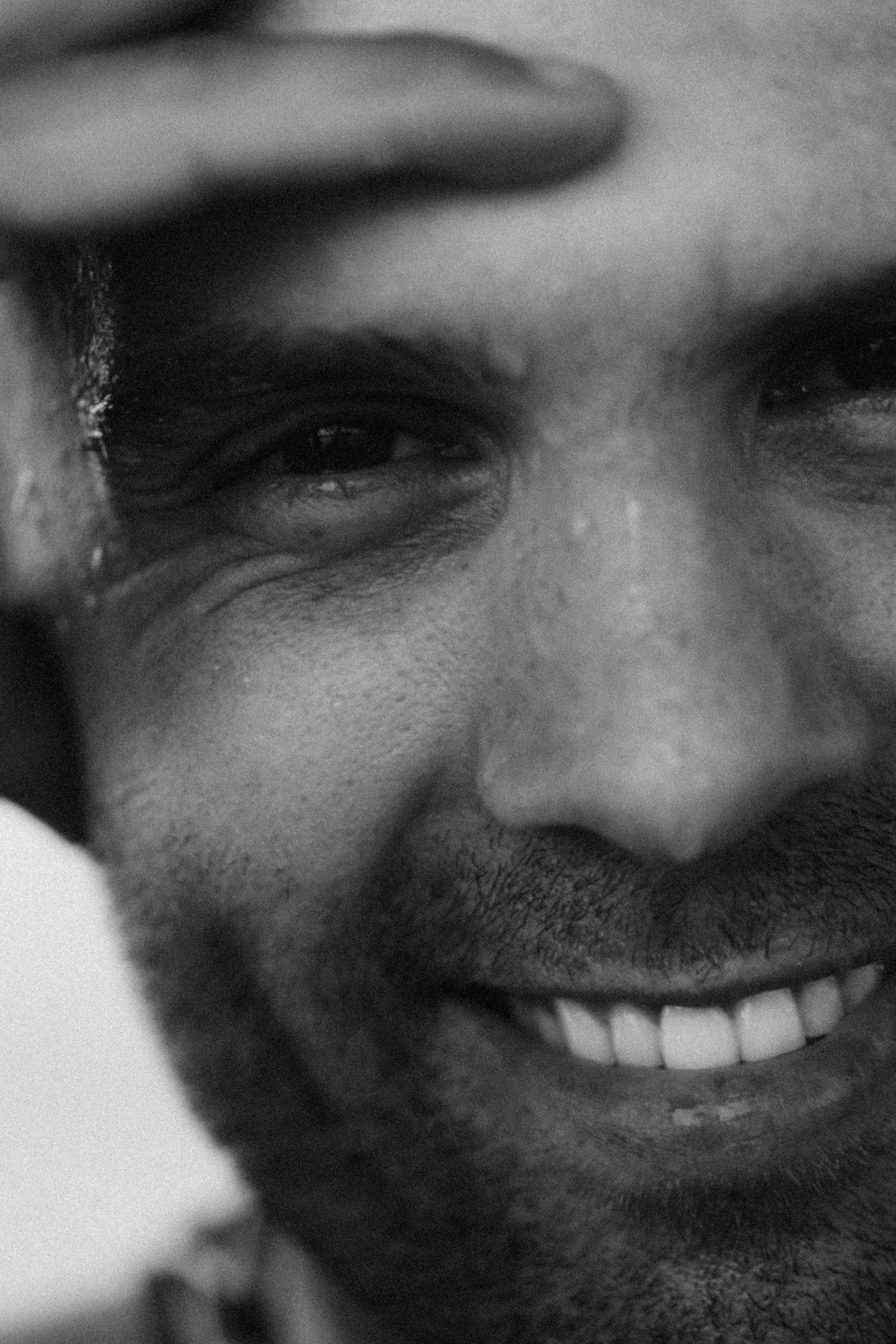 Black and white portrait sequence capturing natural smiles and expressions.