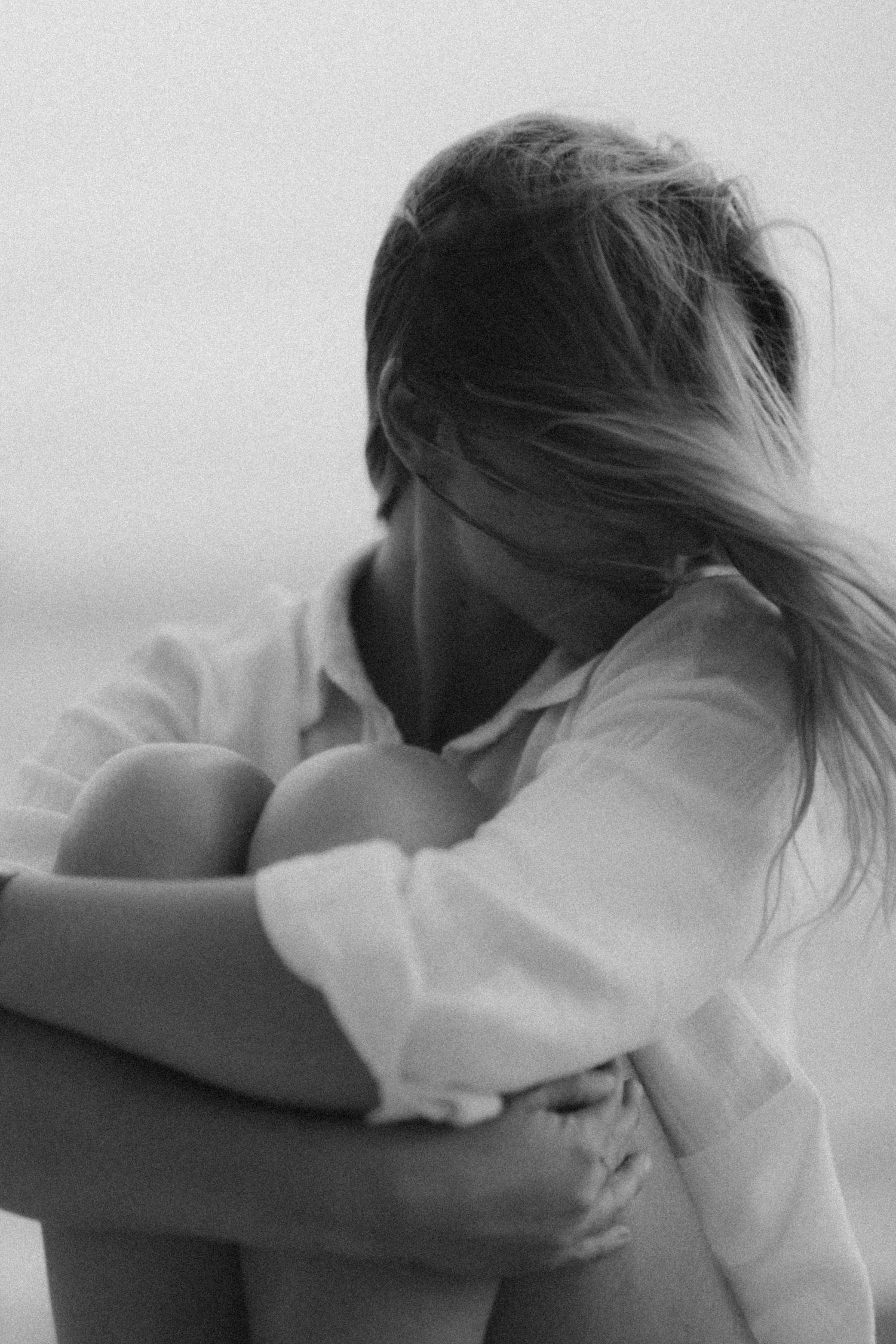Emotional sequence showing a person resting their head on their arms in contemplation.