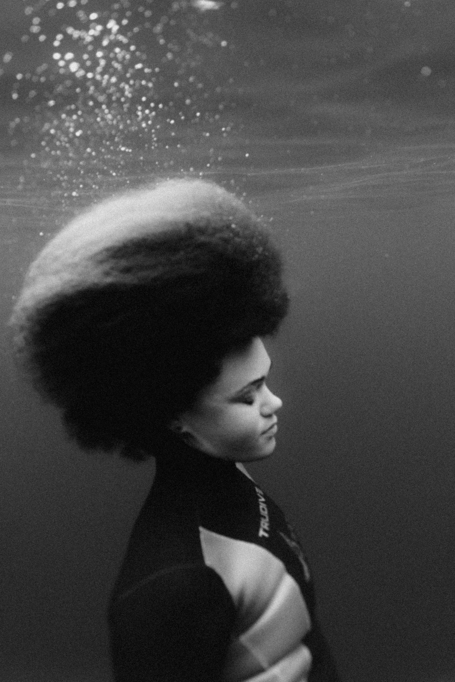 Underwater black and white portrait series showing floating hair and dramatic lighting.