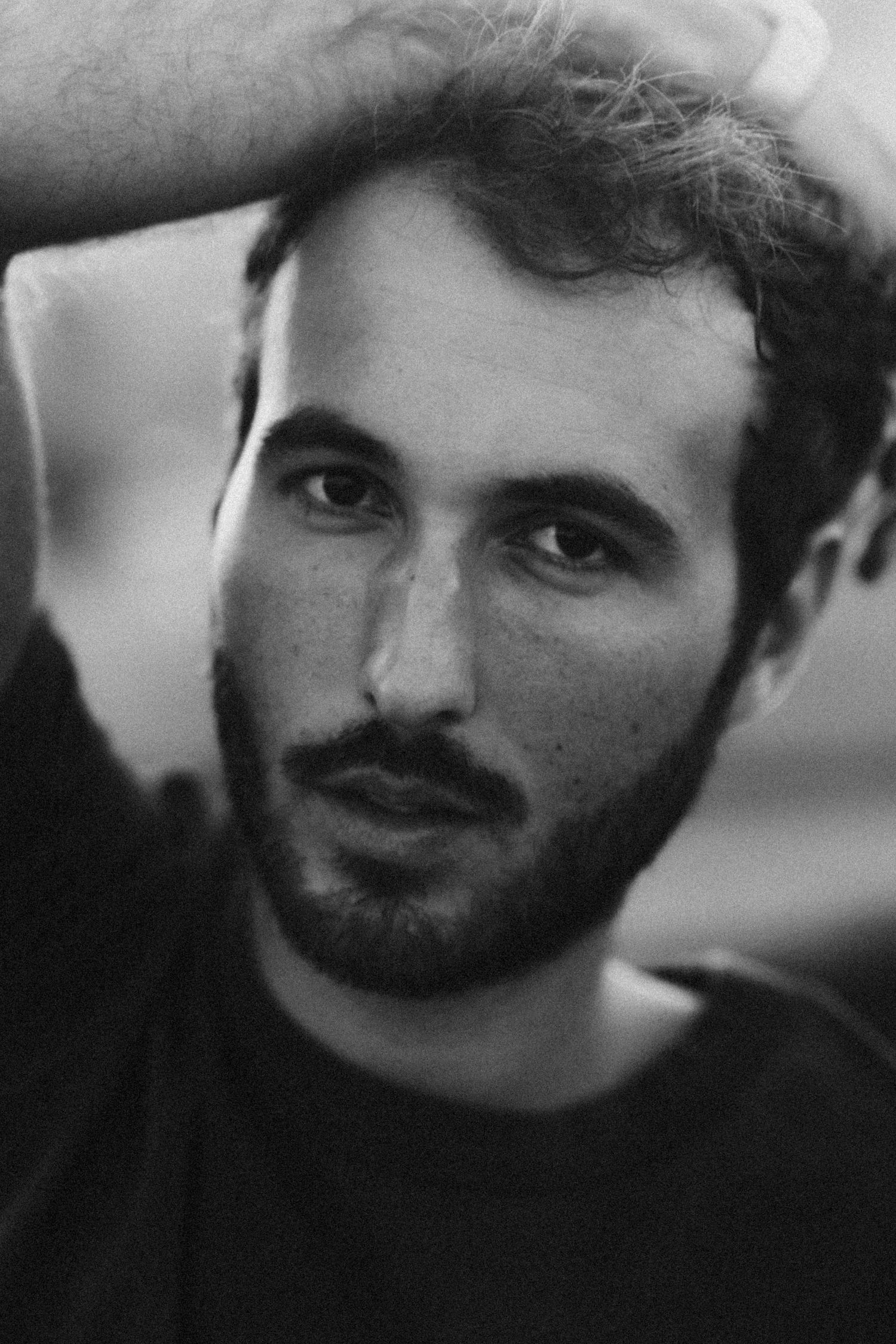 Black and white portrait sequence showing subtle expressions and facial features.