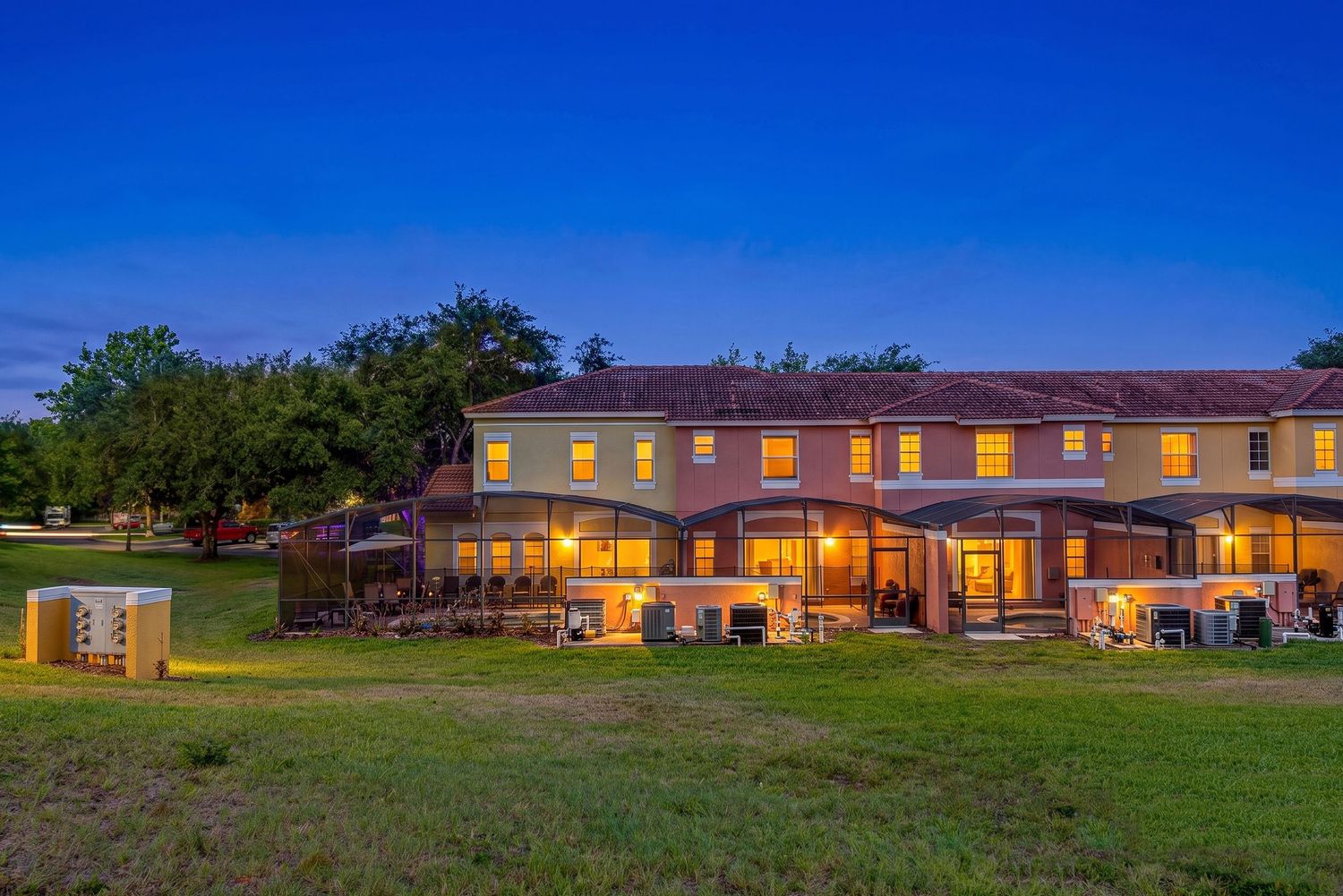Luxury twilight real estate photography highlighting exterior lighting, architecture, and outdoor living spaces.