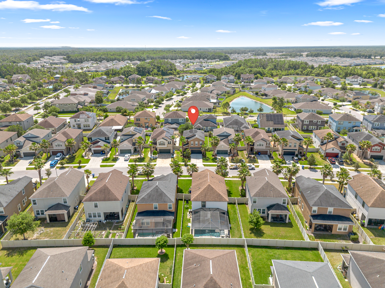 Aerial drone photo of residential neighborhood with location marker – Central Florida real estate media and drone photography