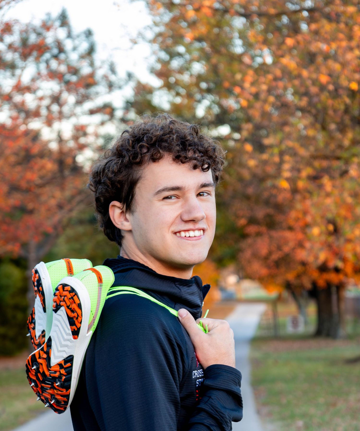 Fall senior session for a senior who had track as a hobby in High school with Refined by Fire Photography located at a Springfield park