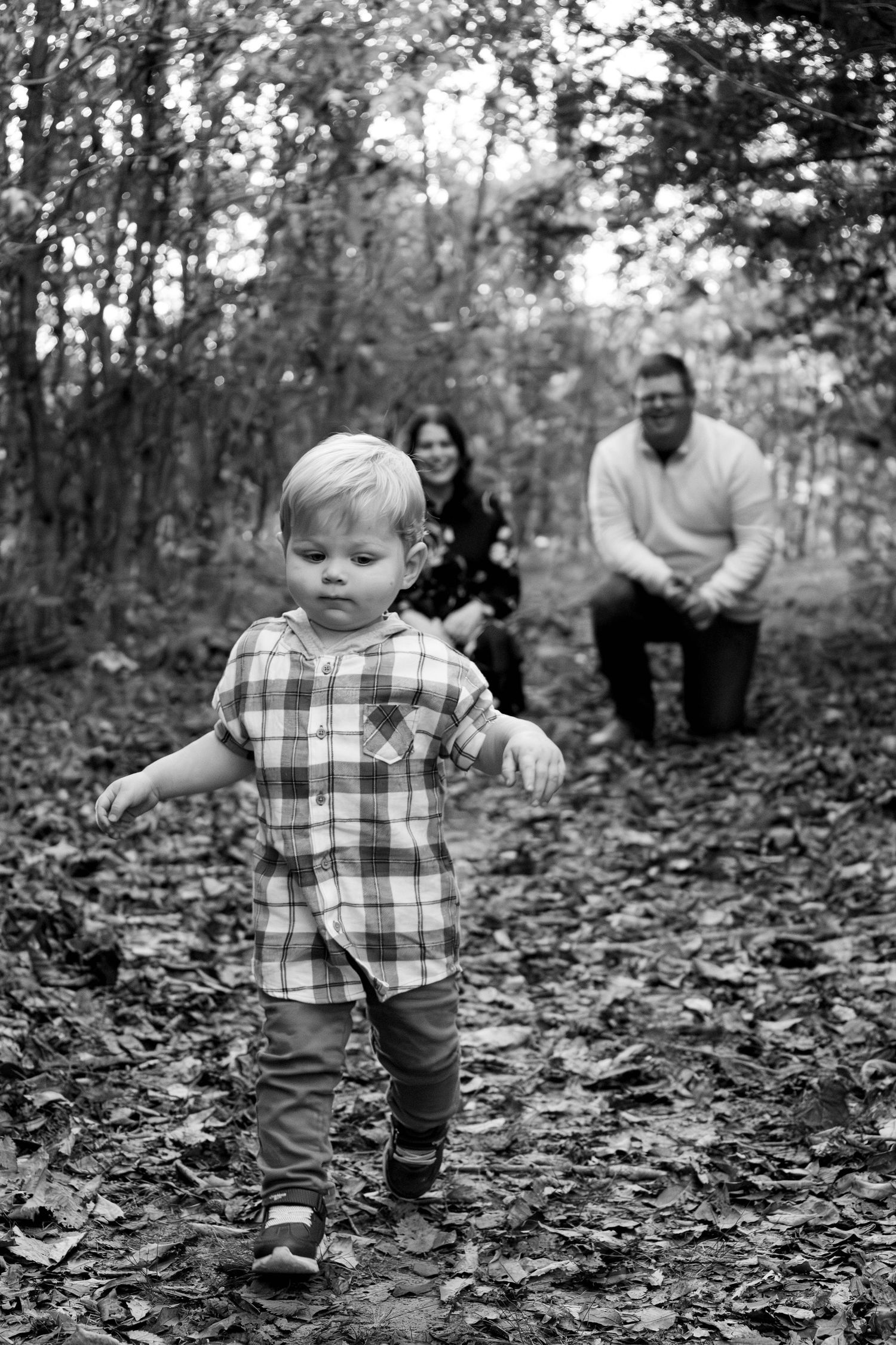 Family of three at fellows lake in Springfield MO during a fall family session perfect for print