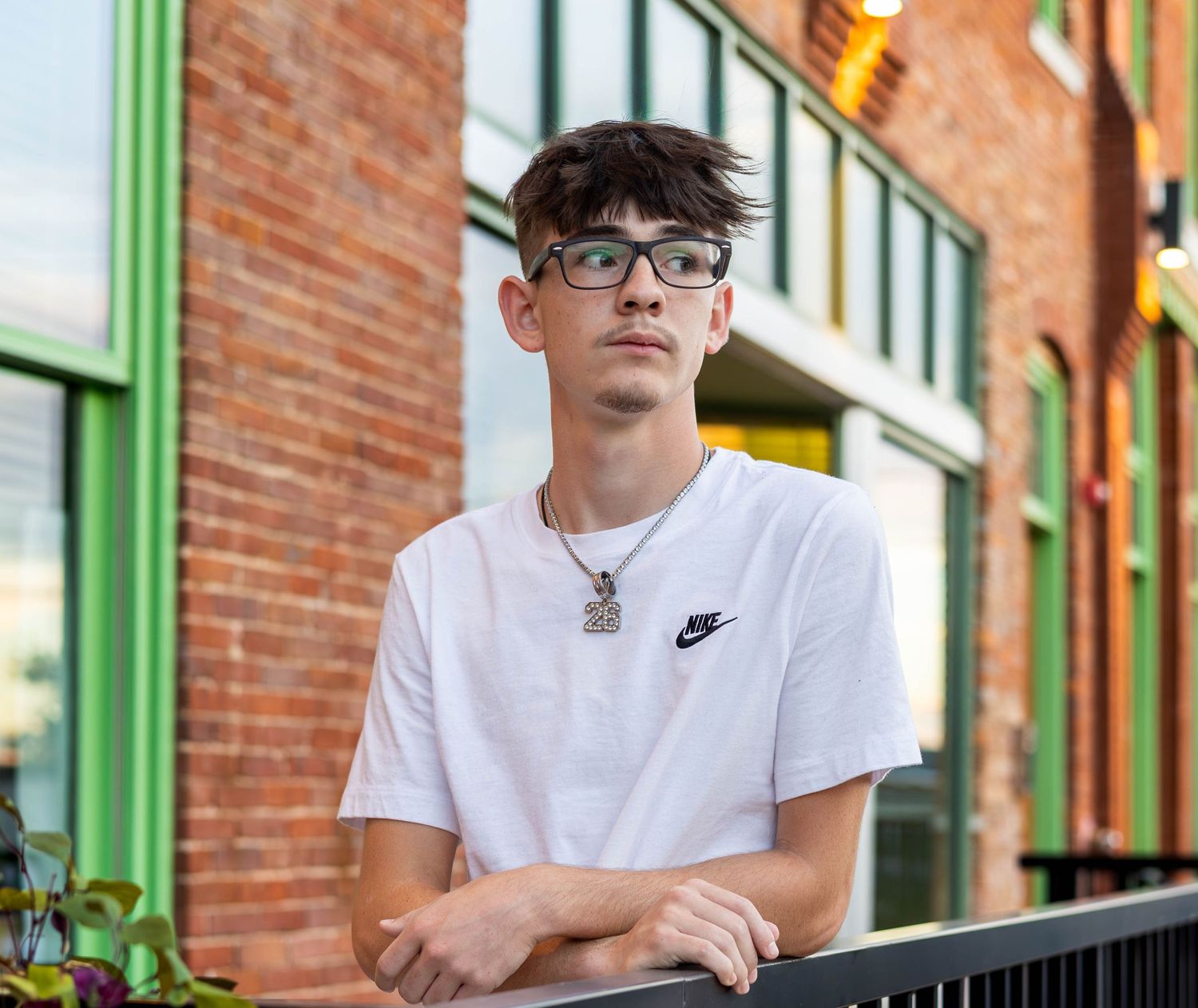 Senior session with fair grove high school student posing as he ponders what the next years look like in Springfield Missouri