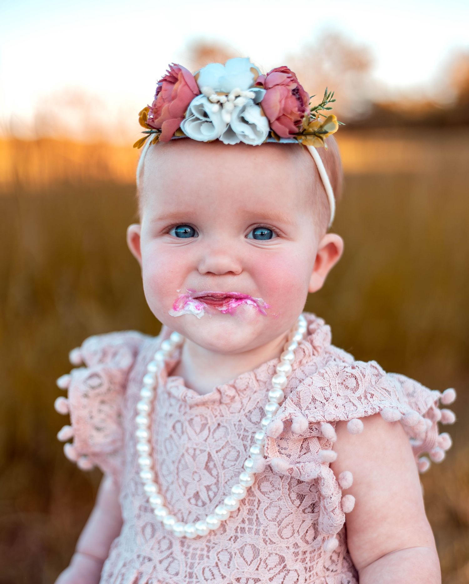 one year old during her smash cake session with Refined by Fire photography located in Strafford MO