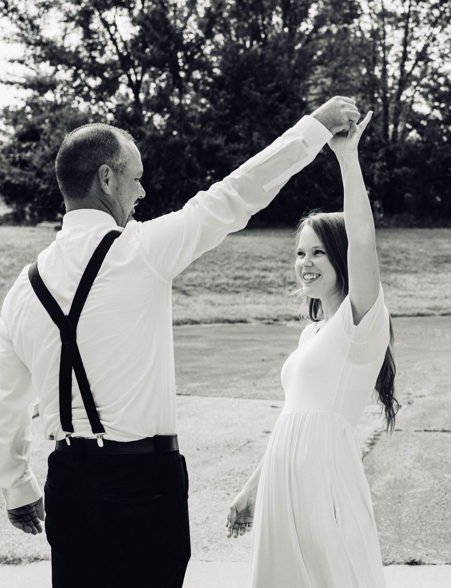 Bride and Groom dancing with a black and white edit in Springfield MO