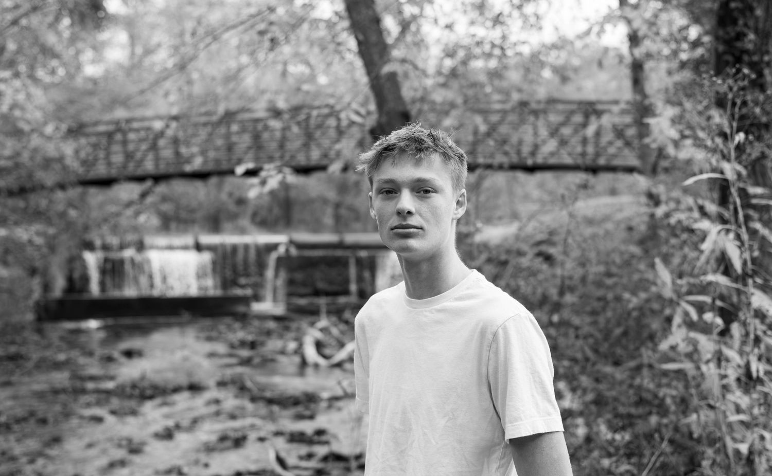 Senior session with Refined by fire photography at Ritter Springs in Springfield mo located near the creek and bridge edited in black white