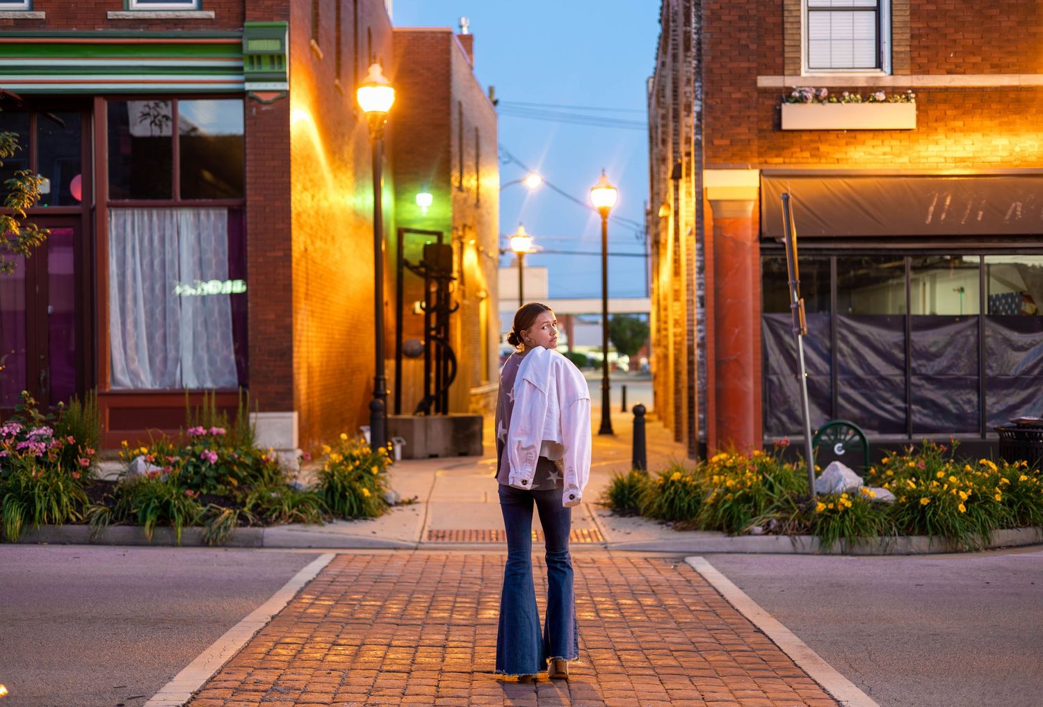 Strafford Senior session enjoying the lights at night on commercial street in Springfield MO