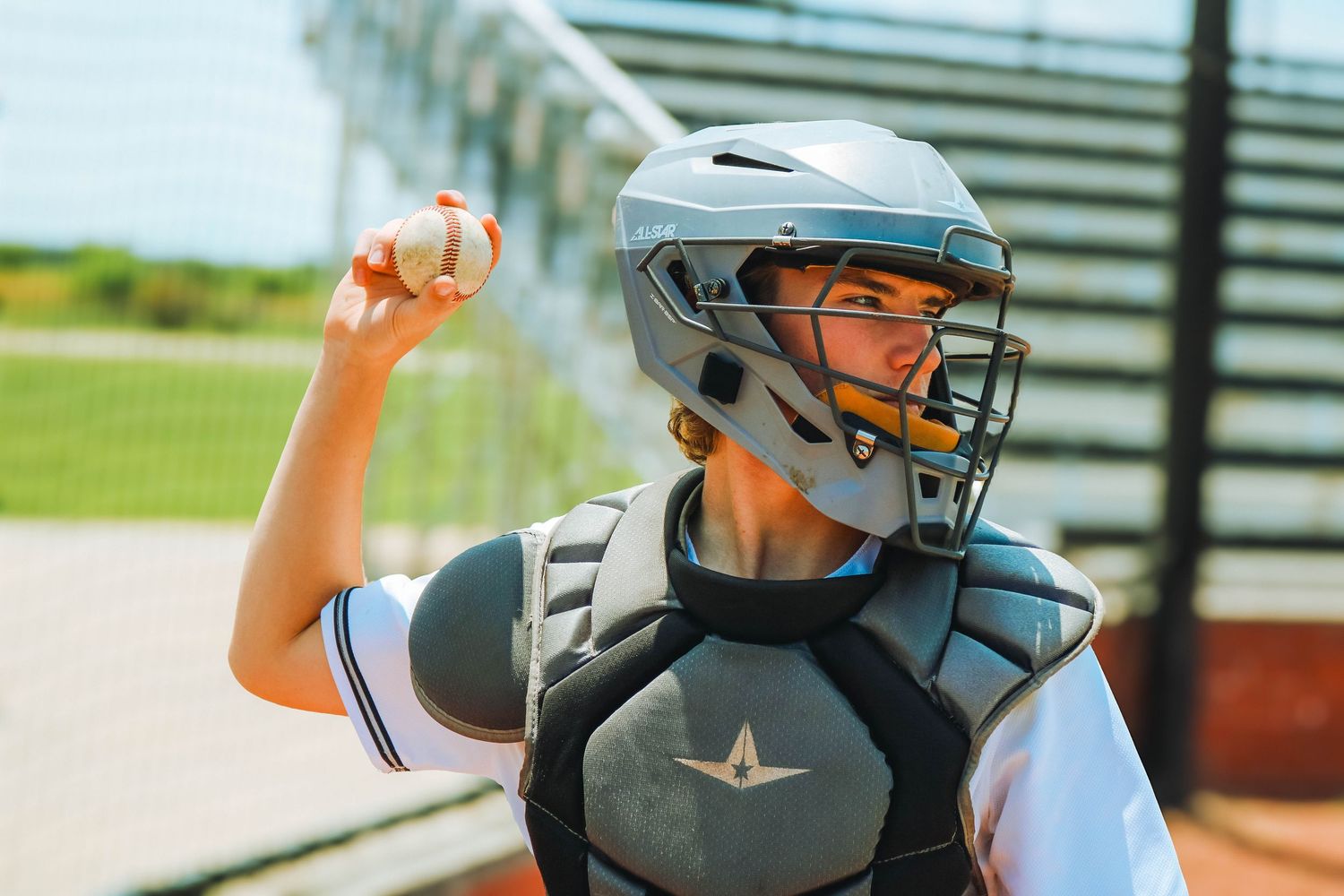 This Wilard MO baseball Senior is throwing the ball during his session with Refined by Fire Photography for his senior session.